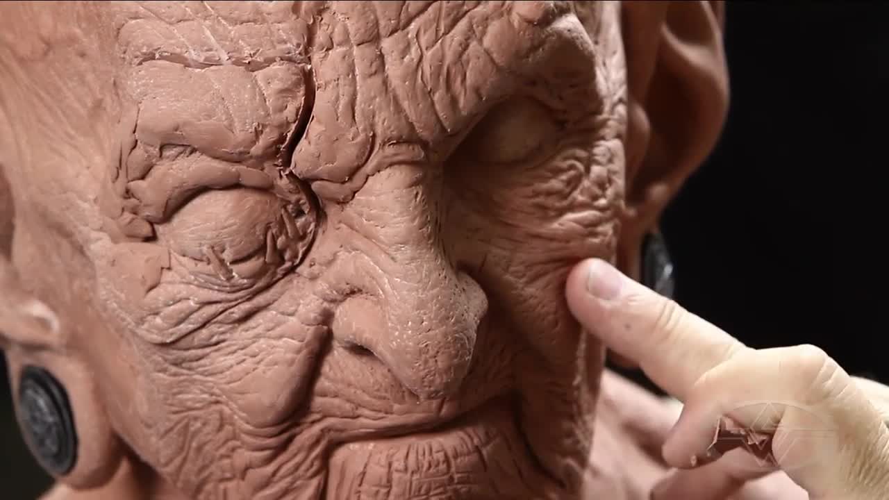 Bruce Spaulding Fuller points out how the cheek on the right has a hollow that he would like the left -  the ruined - side to have.