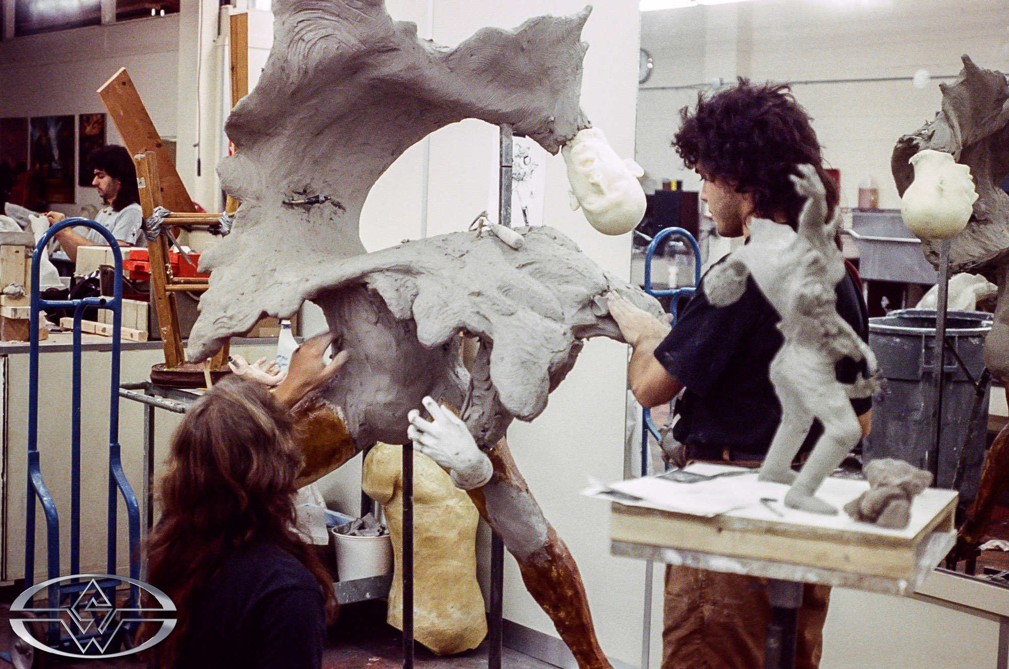 Andy Schoneberg and Christopher Swift work on the life-size pretzel man sculpture, based on the 'pretzel man' maquette.
