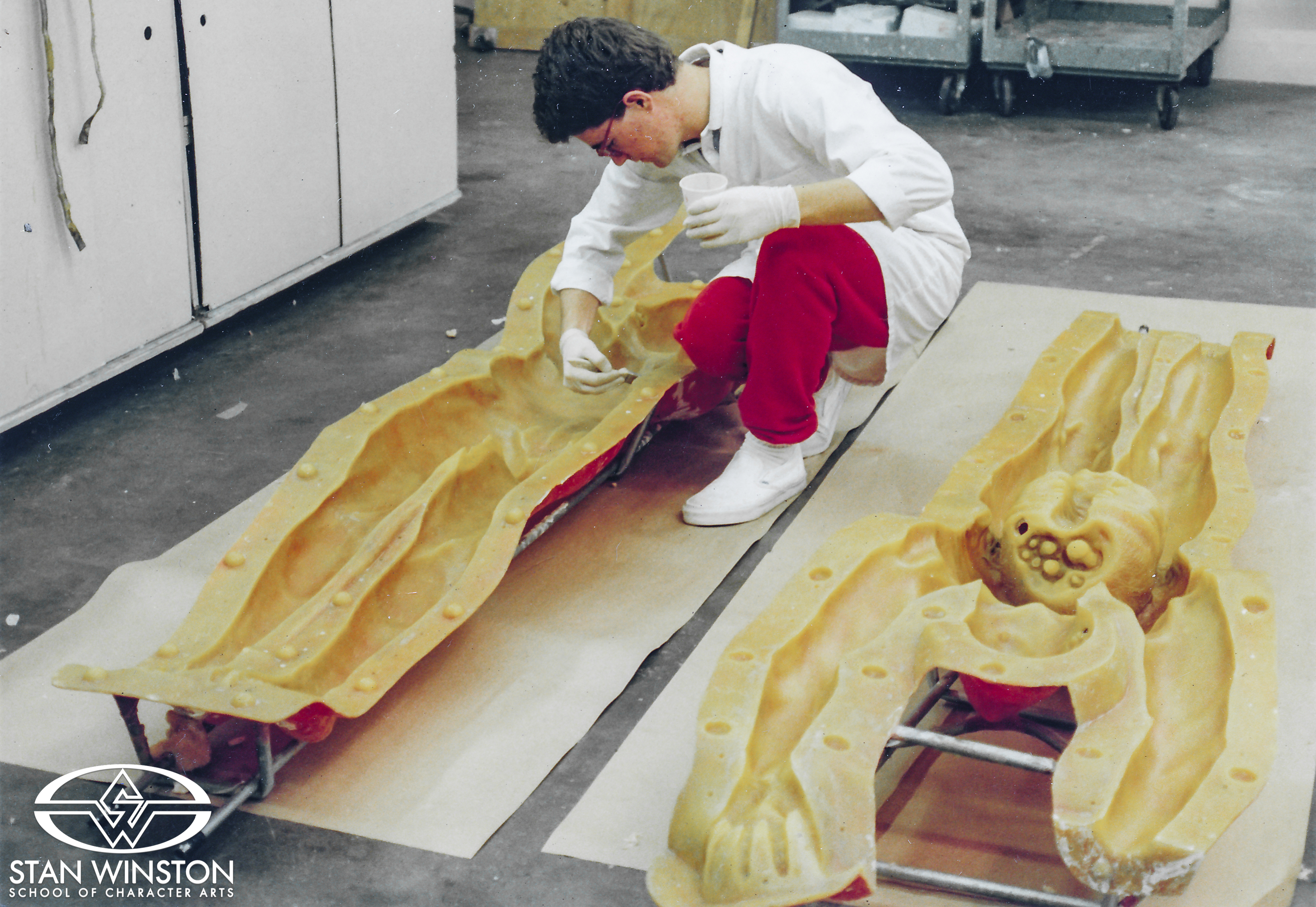 Stan Winston Studio crew member Mitch Coughlin releases a fiberglass mold that will be used to run a foam latex corpse dummy for Predator 2