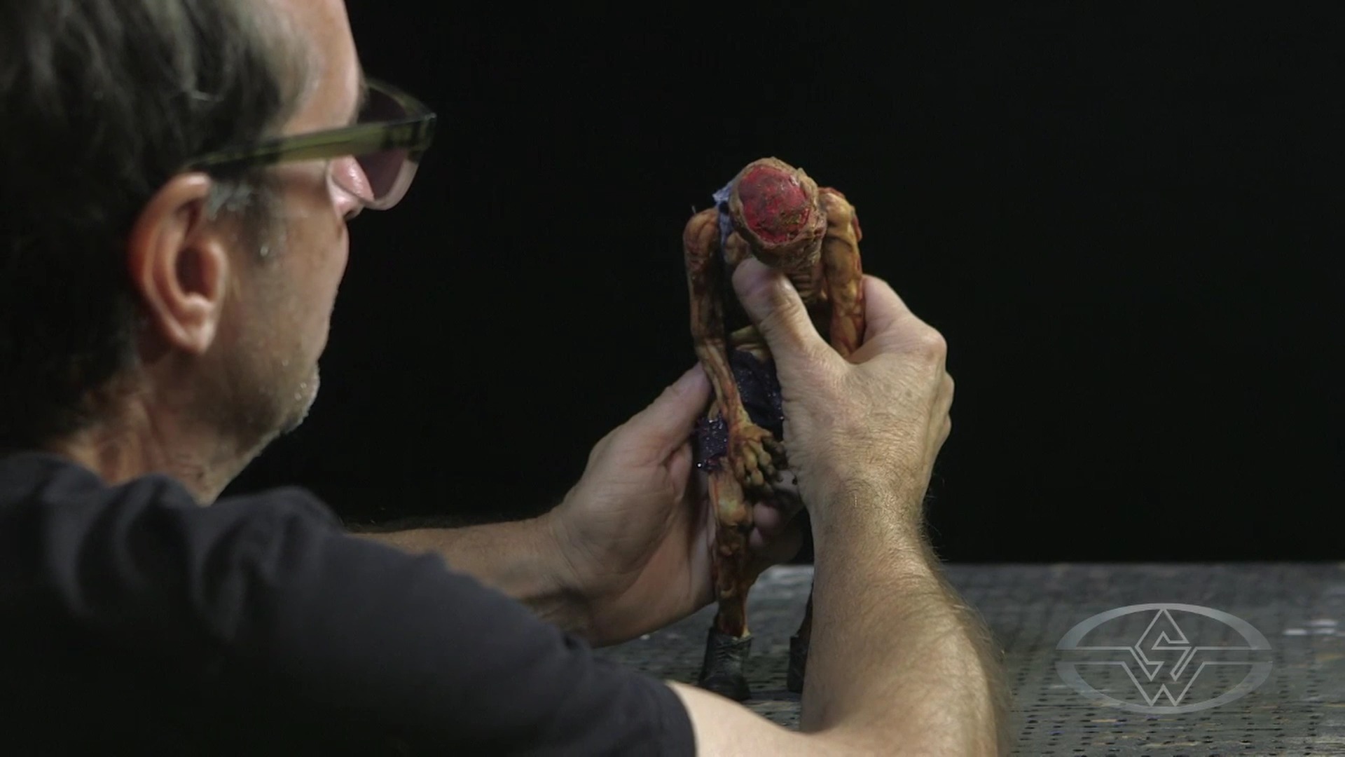 Stephen Chiodo introduces the first movements in his puppet, slightly pressing and pushing the rib cage.