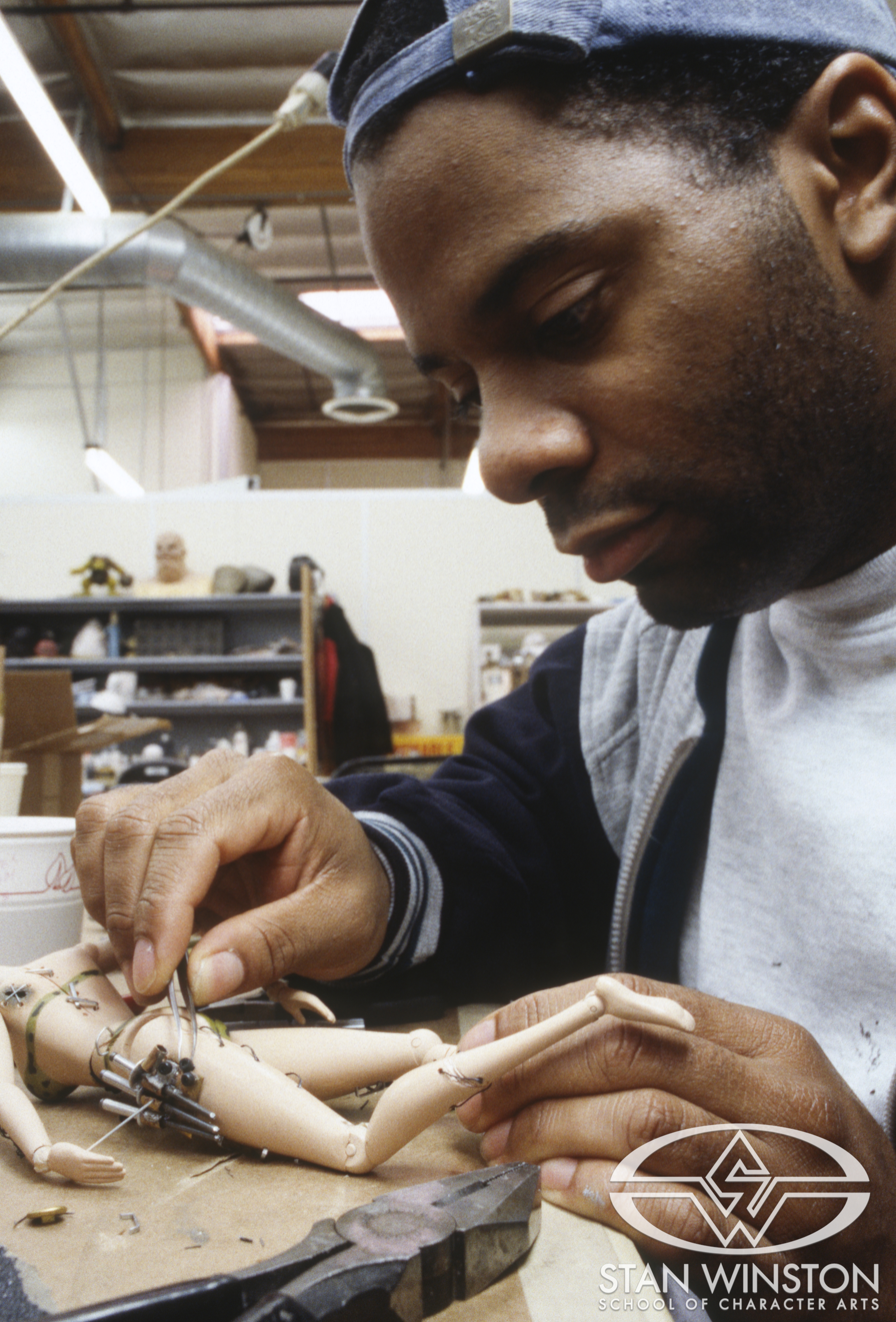 Lance Gilmer works on one of the Gwendy dolls at the Stan Winston Studio.
