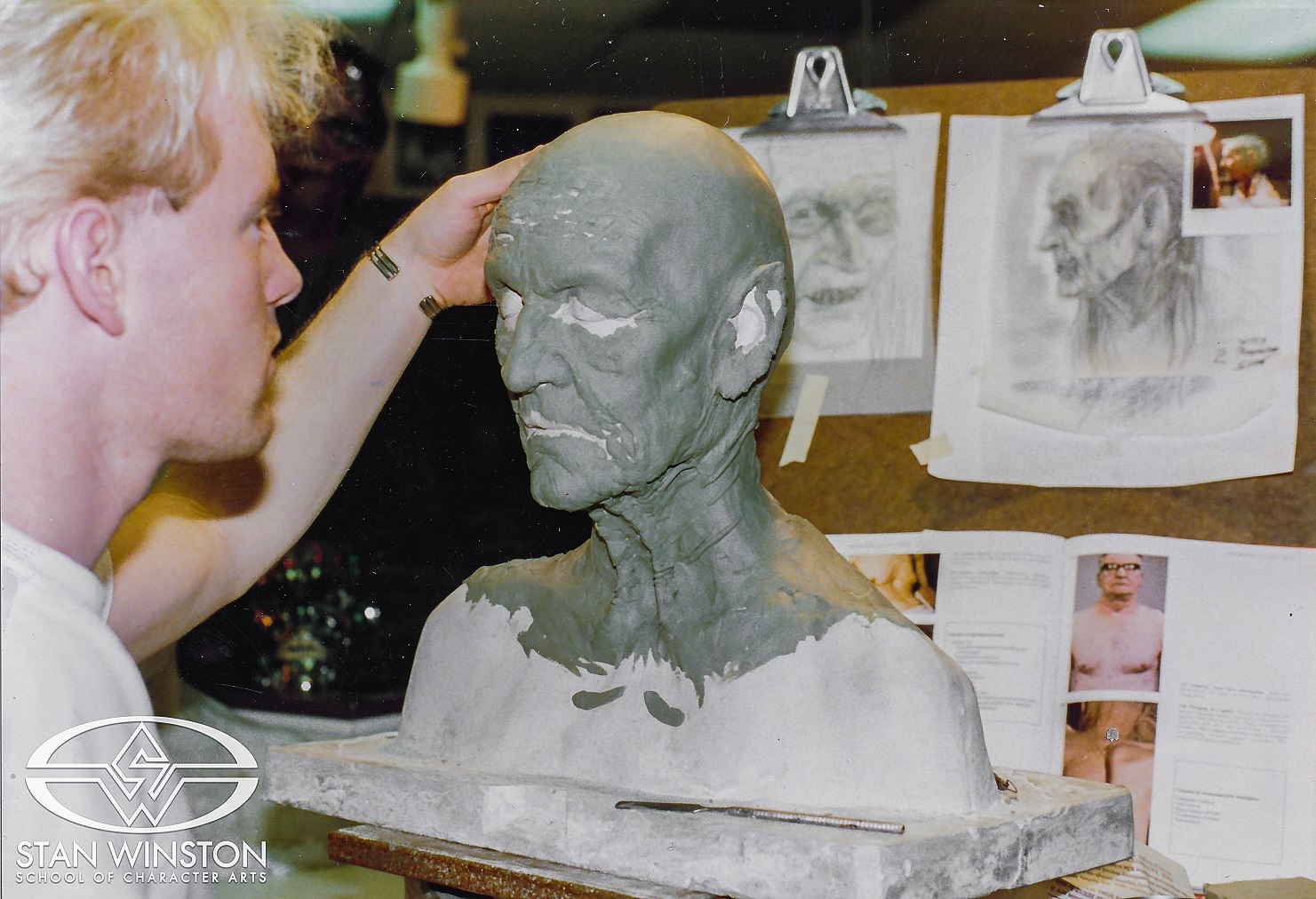 Shane Mahan refers to his witch design sketches as he blocks out the&nbsp;Haggis sculpture.