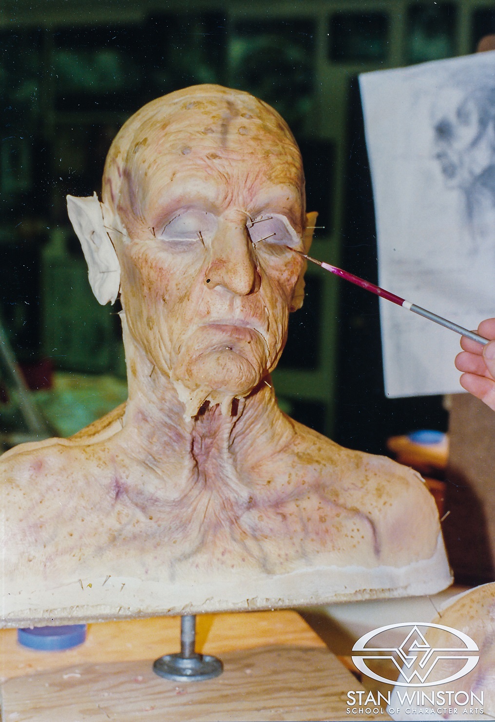 Shane Mahan pre-paints multiple sets of foam latex Haggis appliances at Stan Winston Studio.