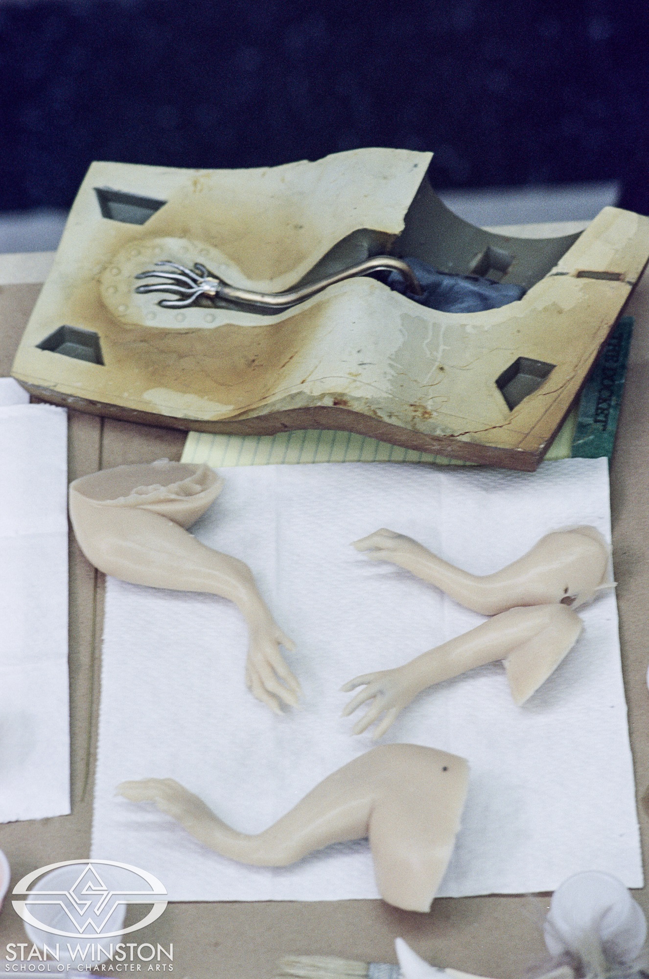 Cast-and-molded tiny mouse limbs before assembling.