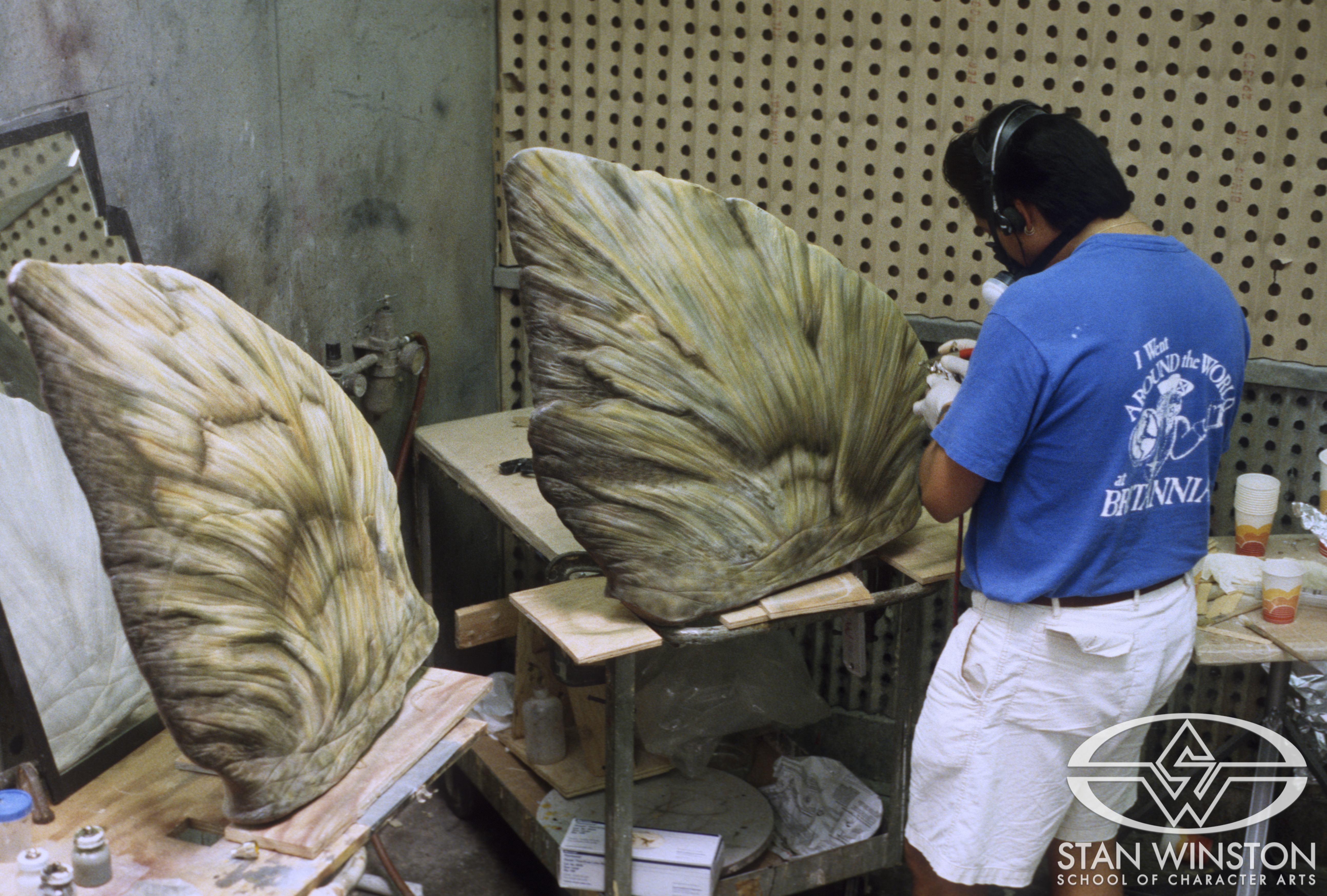 (Michael Ornelaz airbrushing&nbsp;the adult Stegosaurus' back plates.