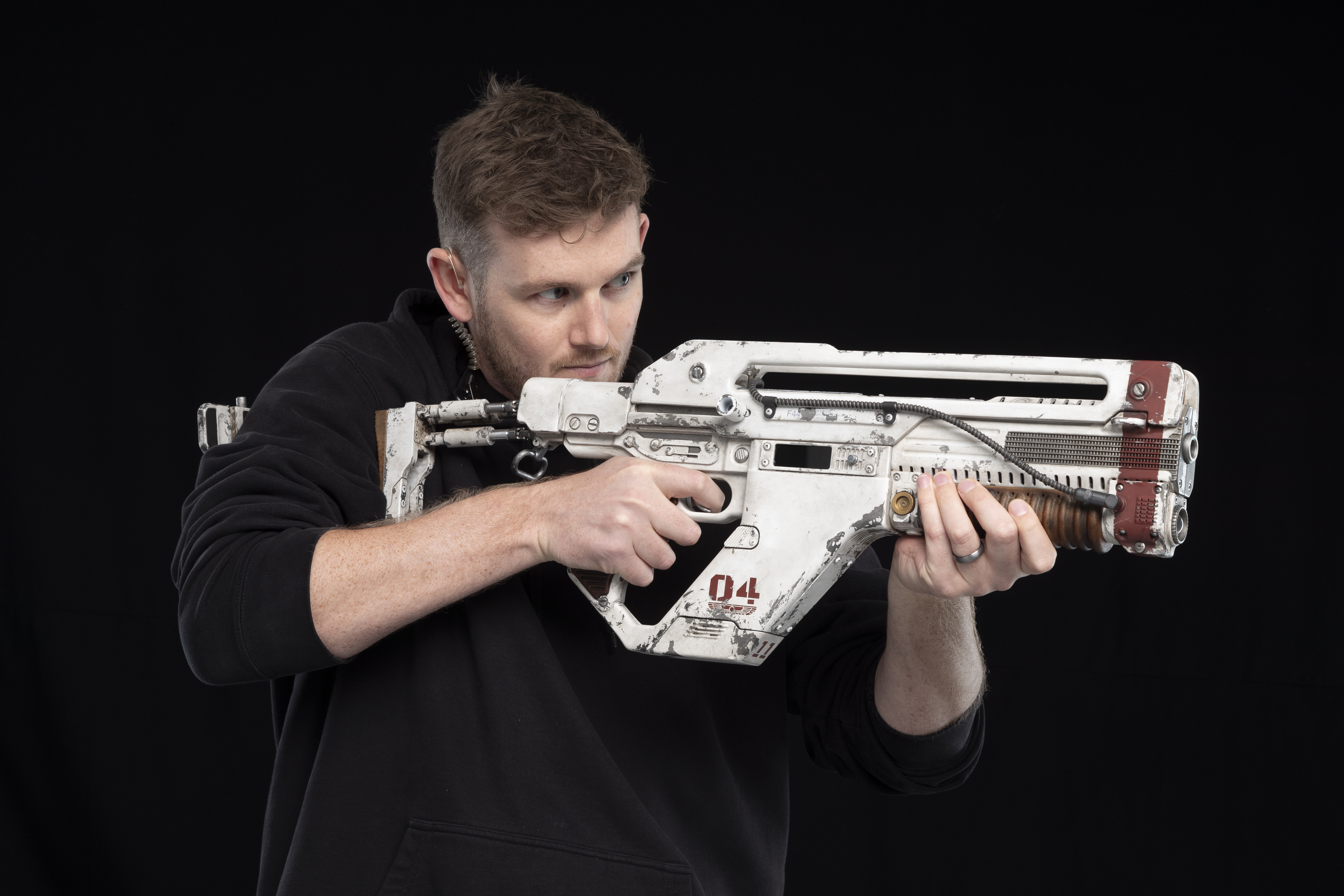 Ben Fairless&nbsp;demonstrates a completed F-44AA Pulse Rifle. Image courtesy Wētā Workshop