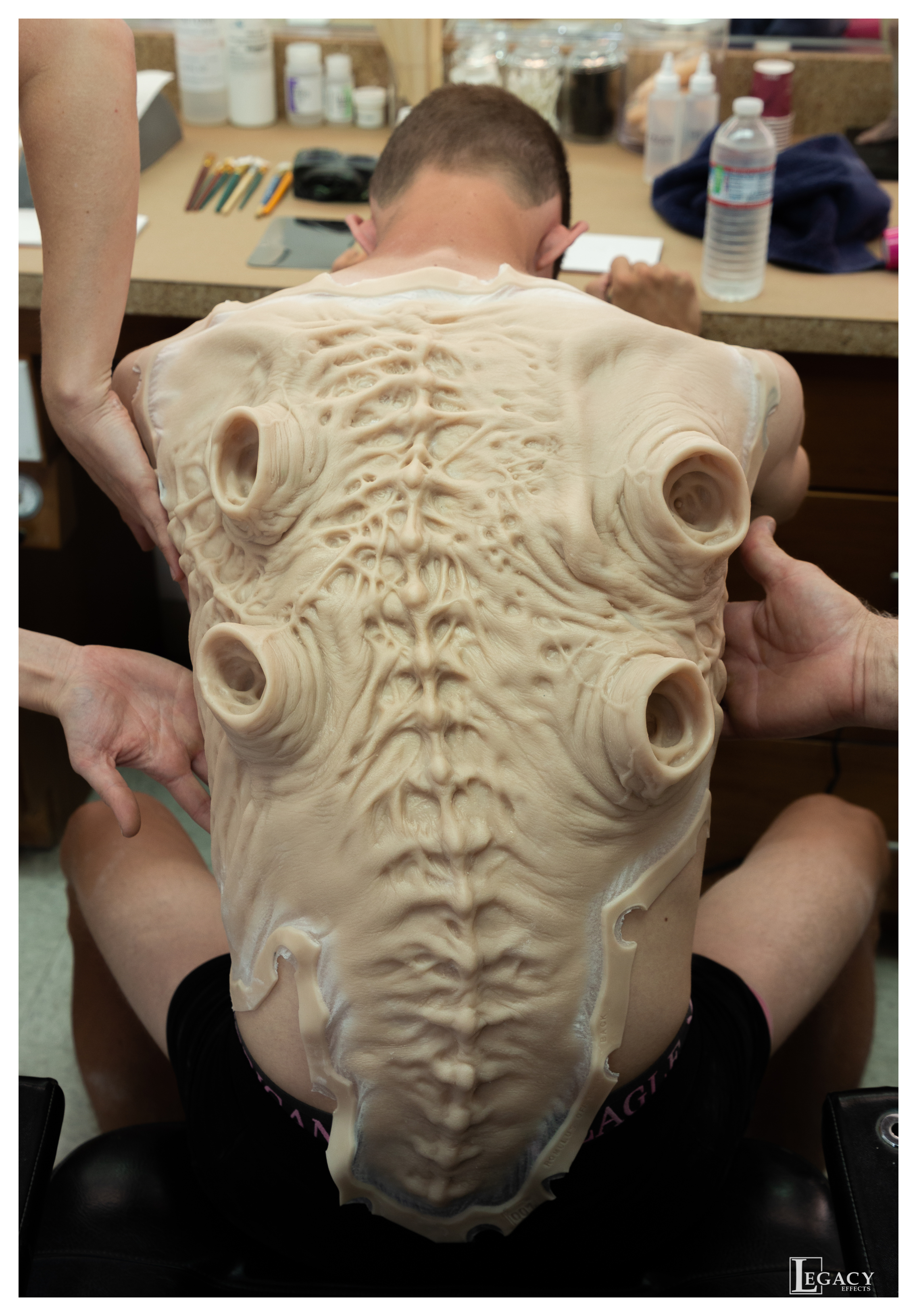 Test fitting the back appliance to Offspring actor Robert Bobroczkyi. Image courtesy Legacy Effects.