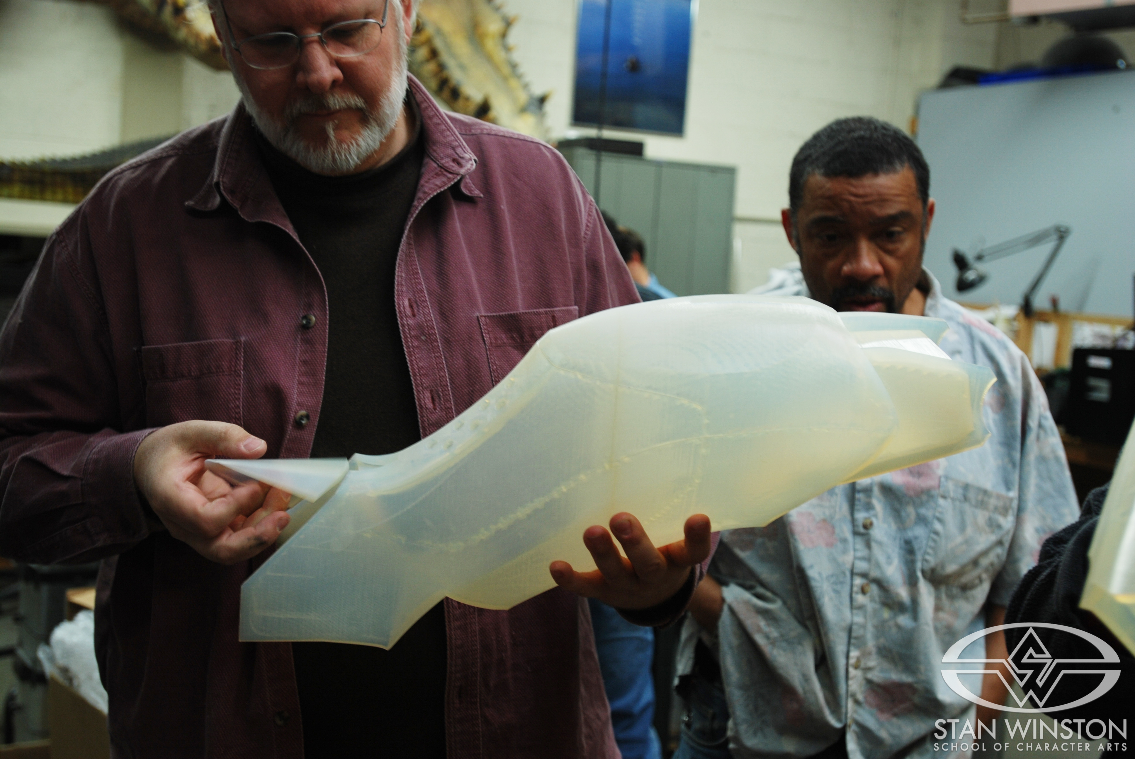 David Merritt and Keith Marbory inspect the raw calf section.