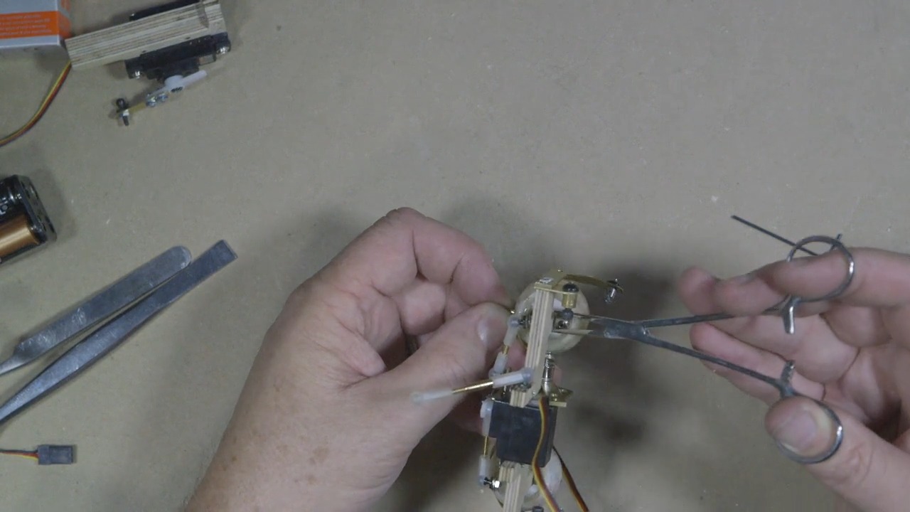 Caton-Largent puts the second dura-collar in between the piece of plywood and the bottom of the eye.
