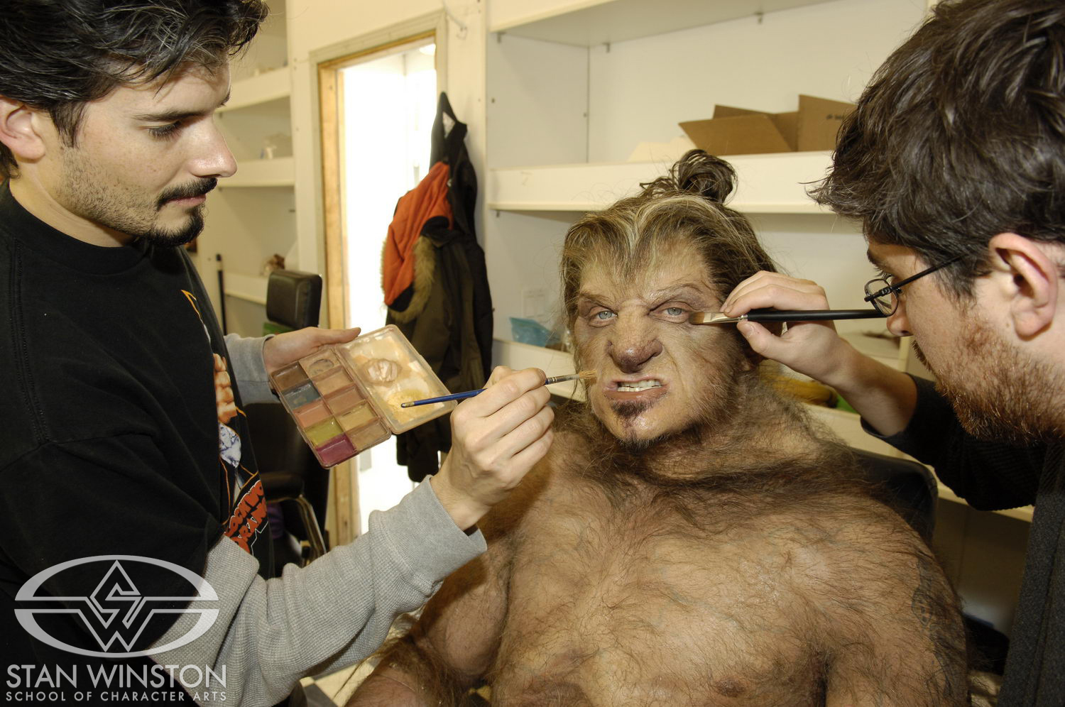 Sean Sansom and Neil&nbsp;Morrill apply the werewolf&nbsp;makeup to Kim Coates.
