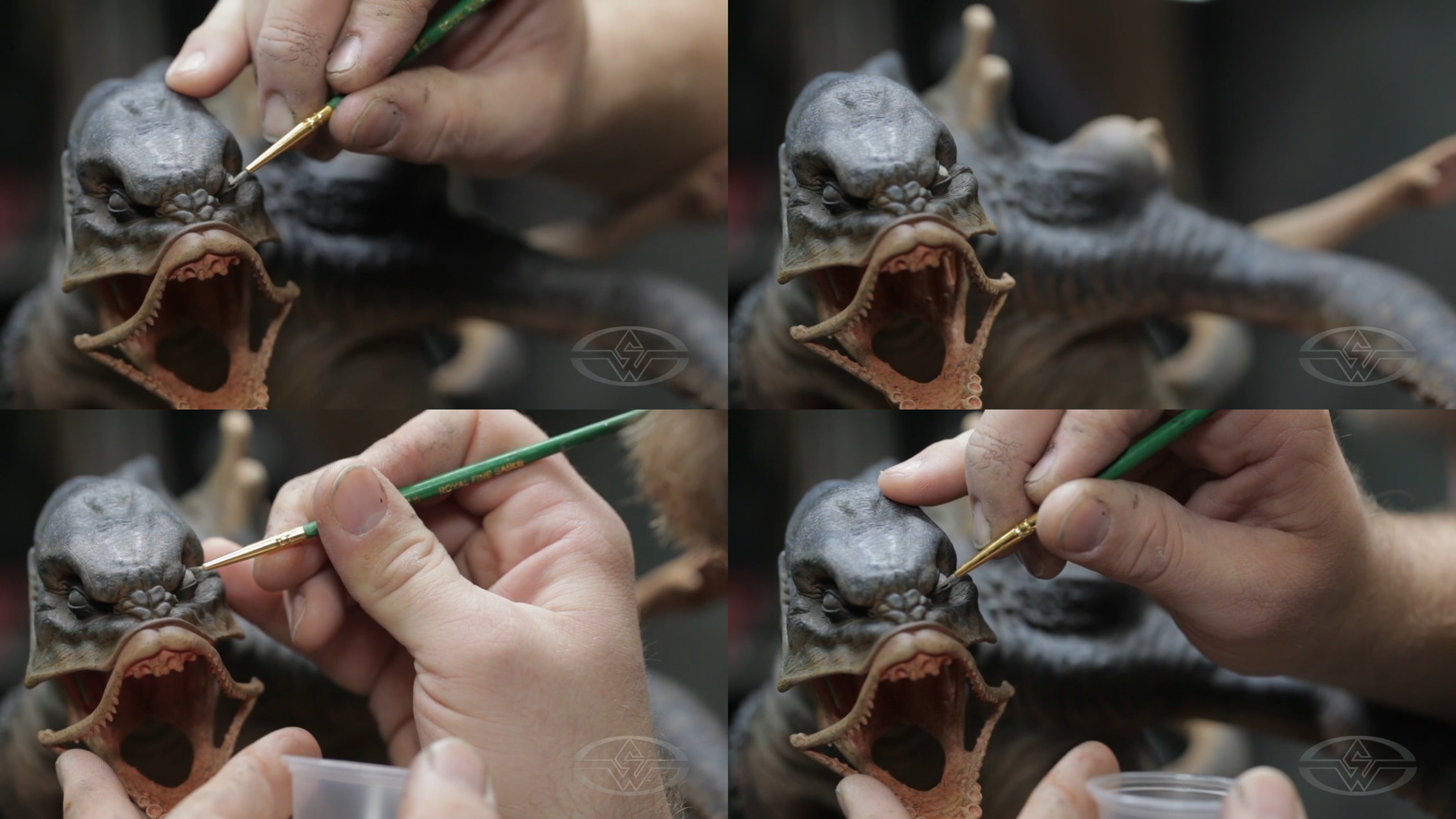 Timothy Martin carefully paints the whites of his Leviathan monster's left eye using an off-white shade.
