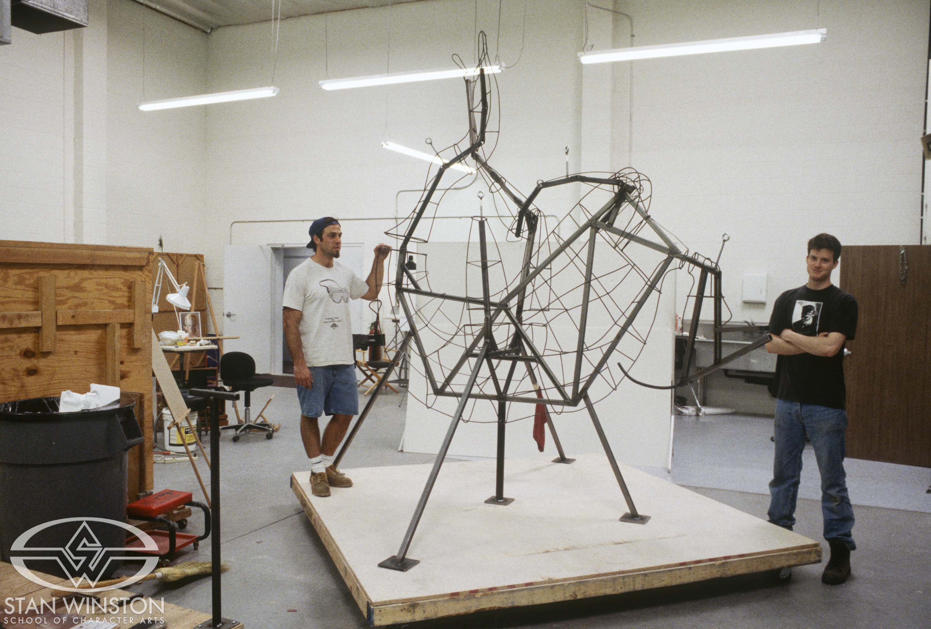 The understructure of the life-size dead Parasaurolophus between Rob Ramsdell (left) and Kevin McTurk (right) is ready for the clay build-up.