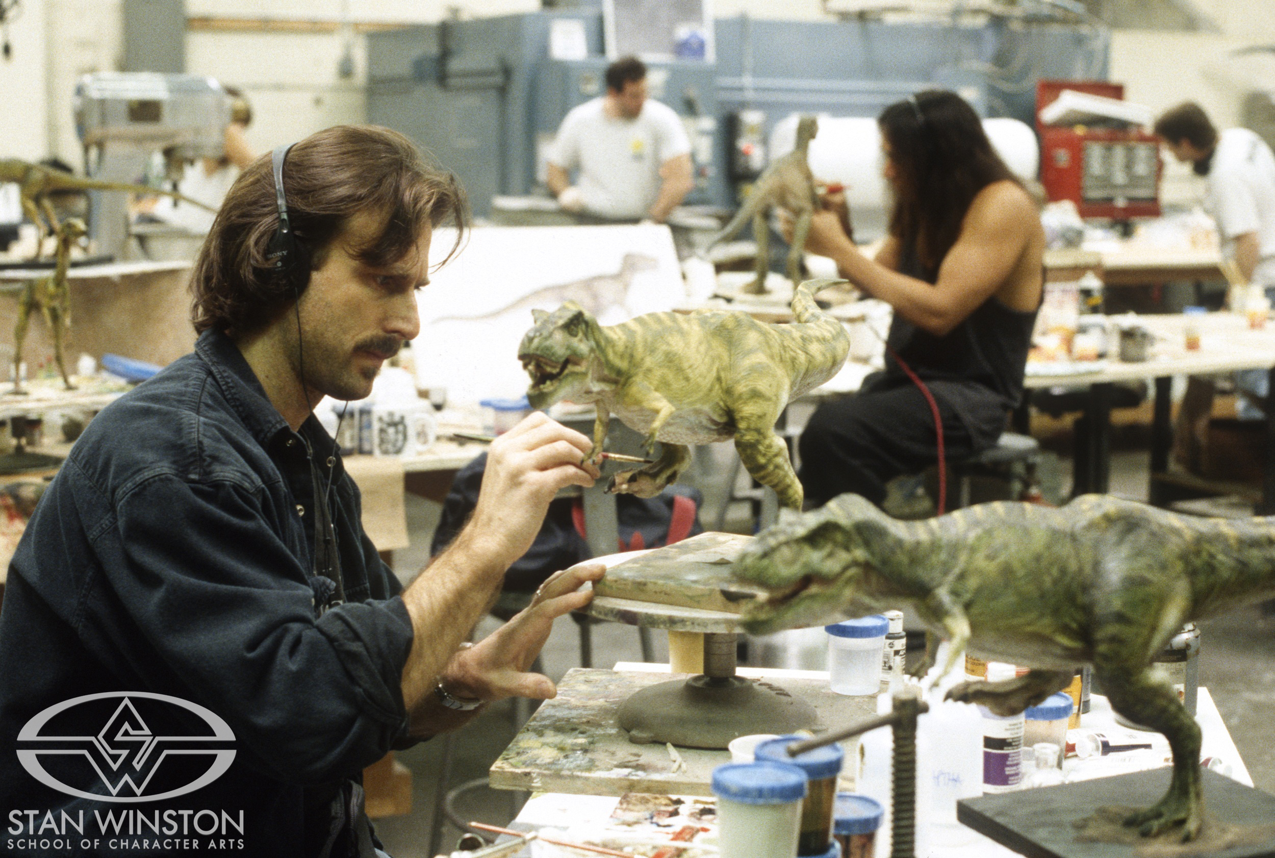 John Rosengrant paints one of the 1/5th scale&nbsp;male T-Rex maquettes at Stan Winston Studio.