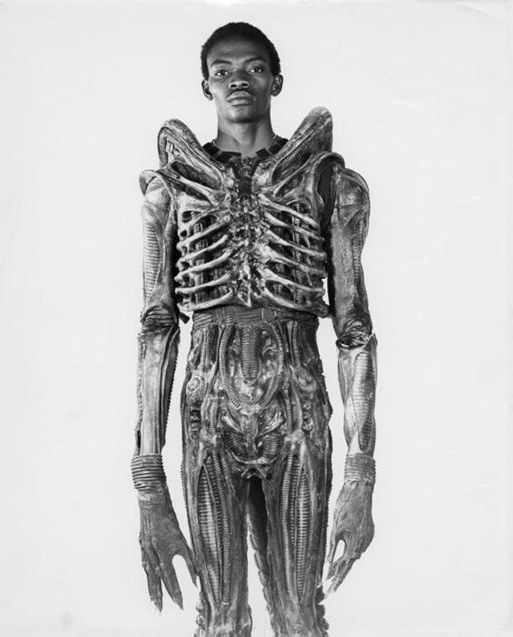 Bolaji Badejo posing in the original alien suit for an&nbsp;Alien (1979) promo shot.&nbsp;Image courtesy of&nbsp;20th Century Fox.