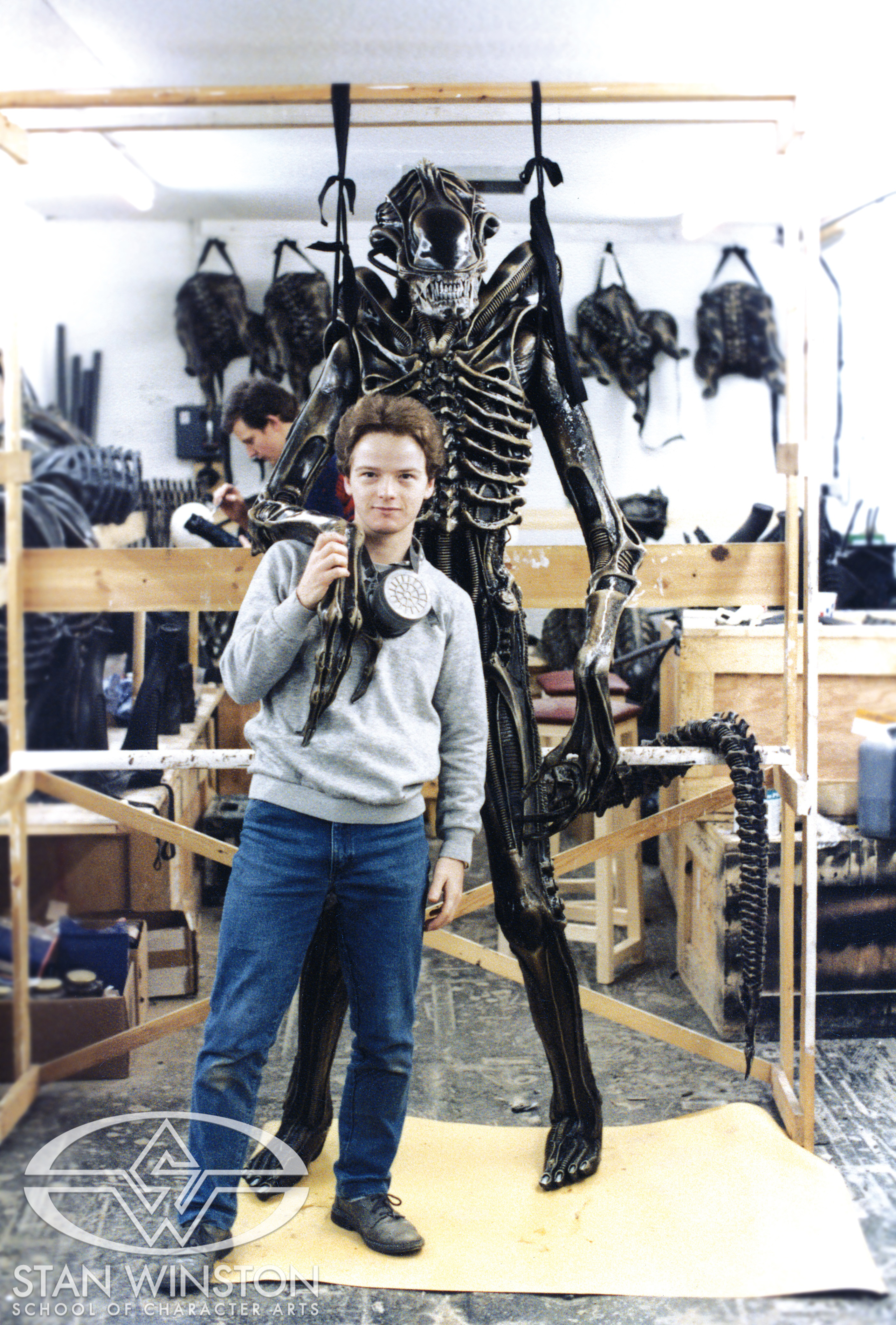 Lindsay Macgowan poses with one of the&nbsp;eight-foot-tall xenomorph puppets at Pinewood Studios.