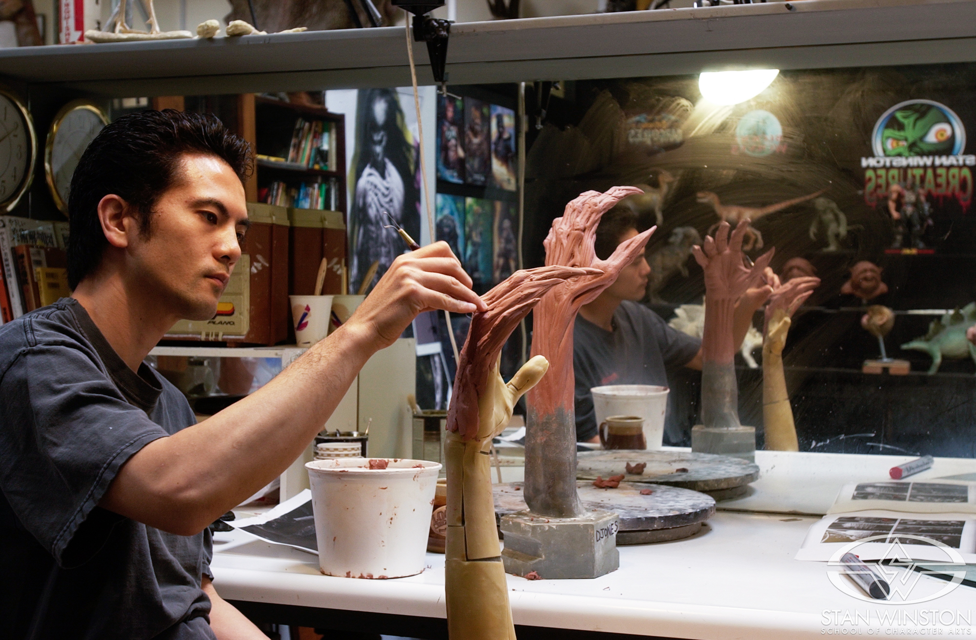 Hiroshi Katagiri sculpts one of the Harvesters' hands for The Deaths of Ian Stone.