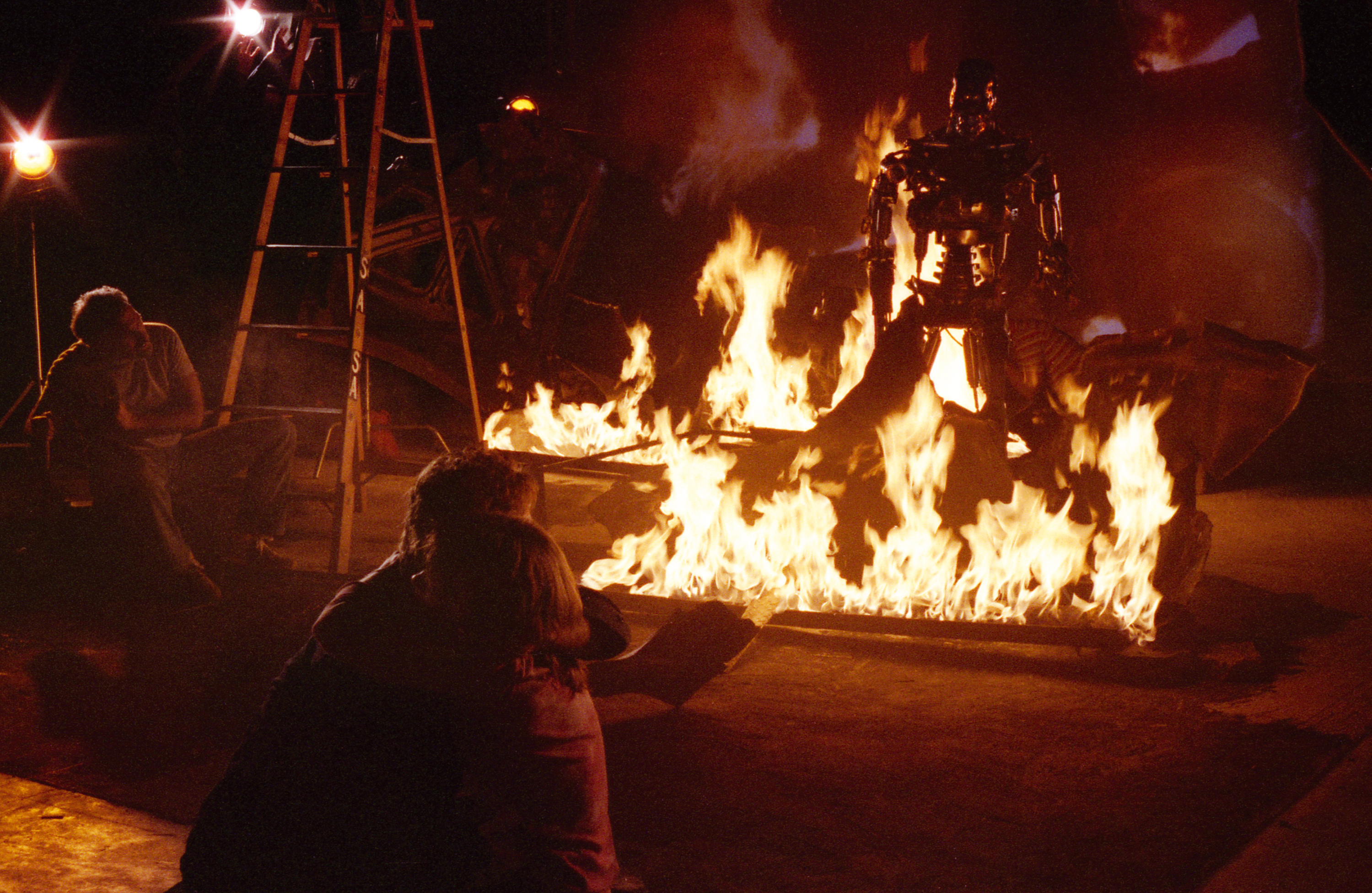 Stan Winston overseeing the shot of the endoskeleton rising from the&nbsp;flaming debris&nbsp;of the exploded tanker truck.&nbsp;Image courtesy of Hemdale Film, Pacific Western Productions, Euro Film Funding, and Cinema '84.