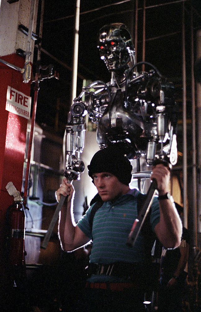 Shane Mahan puppeteering the Terminator endoskeleton via the attached rods to move the arms and shoulders. Off-camera puppeteers radio-controlling the endoskeleton puppet’s head and eyes.&nbsp;Image courtesy of Hemdale Film, Pacific Western Productions, Euro Film Funding, and Cinema '84.