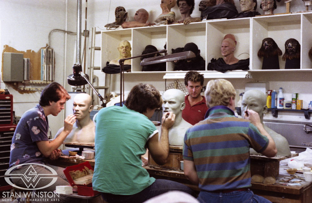 Tom Woodruff Jr., Brian Wade, Shane Mahan, and John Rosengrant work on Schwarzenegger clay sculptures.