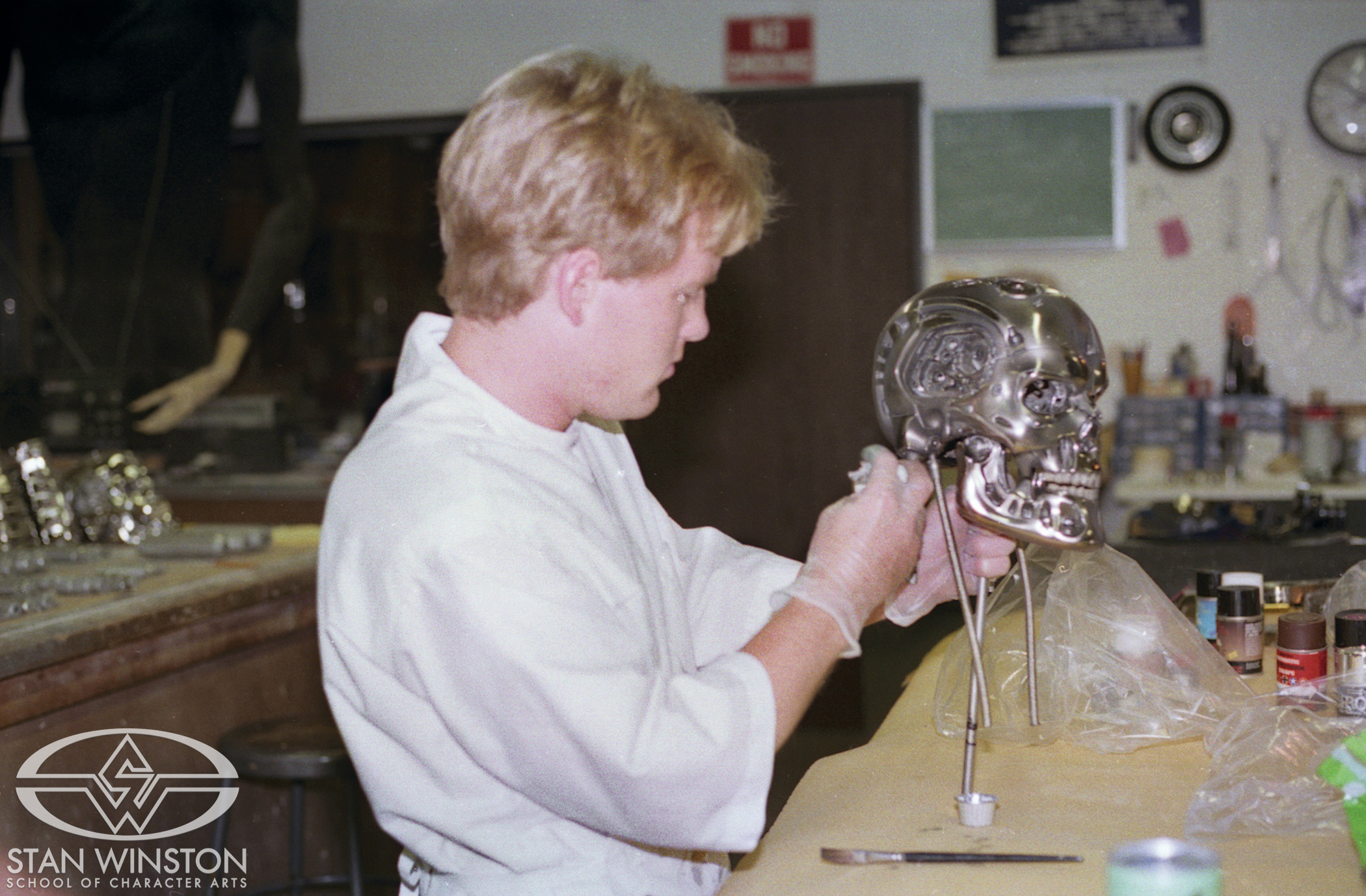 Shane Mahan adds paint details to the Terminator skull.