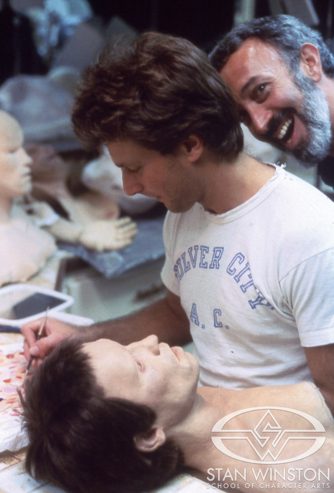 Stan Winston photo-bombing John Rosengrant while he paints one of the Schwarzenegger heads, featuring hair that had not yet been cut or dressed to match the actor.